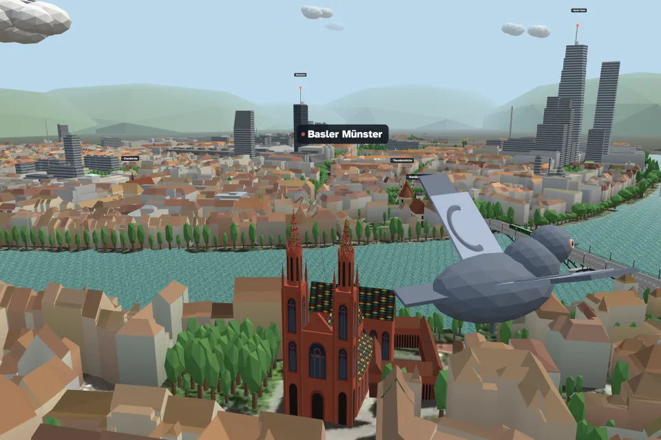 A grey pigeon flying over Basel's old town beside the red sandstone Münster, with the Rhine and the Roche towers behind